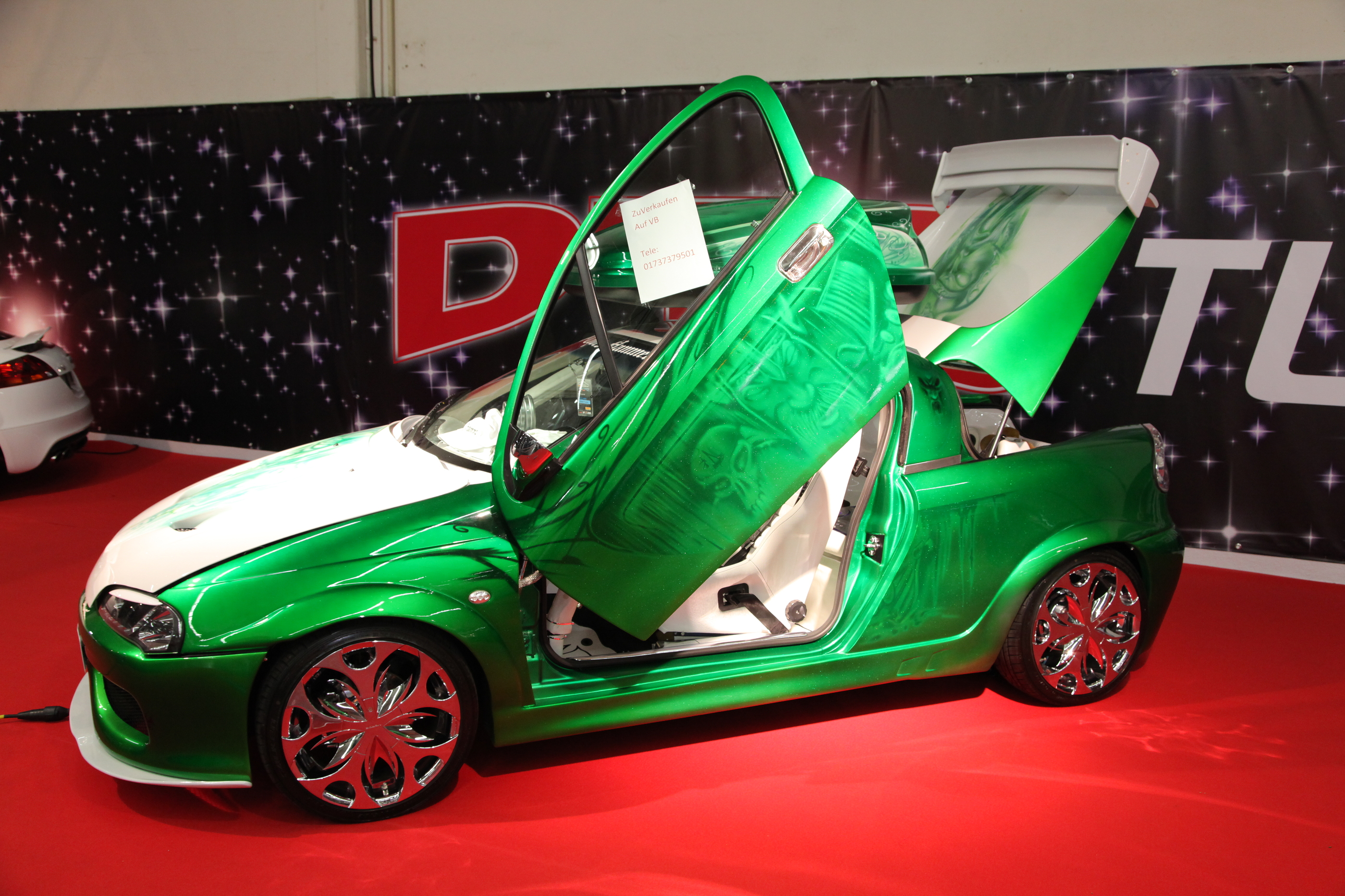 ESSEN, GERMANY - NOV 29: OPEL TIGRA WITH GULL-WING DOORS FROM DTS TUNINGSTAR SHOWN AT THE ESSEN MOTO BY P.LANGE