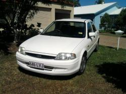 FORD LASER white